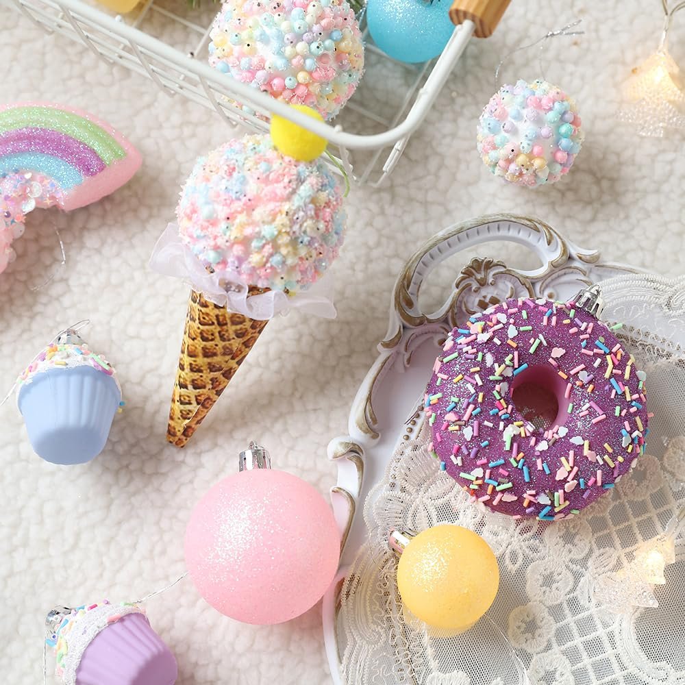 Assortment of pastel Christmas ornaments including ice cream cone, donut, cupcakes, and rainbow shapes.