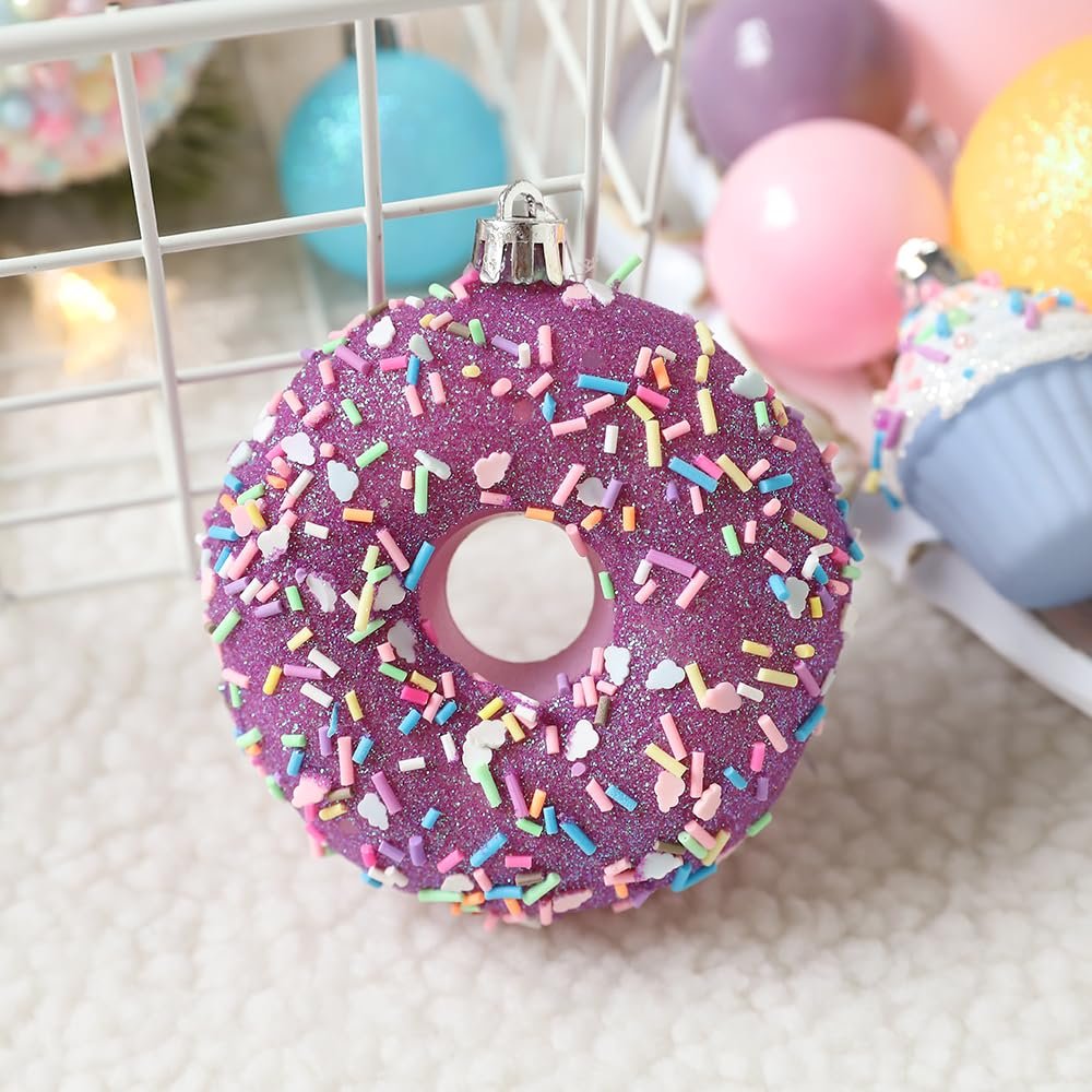 Purple donut-shaped Christmas ornament with colorful sprinkles and glitter, close-up view.