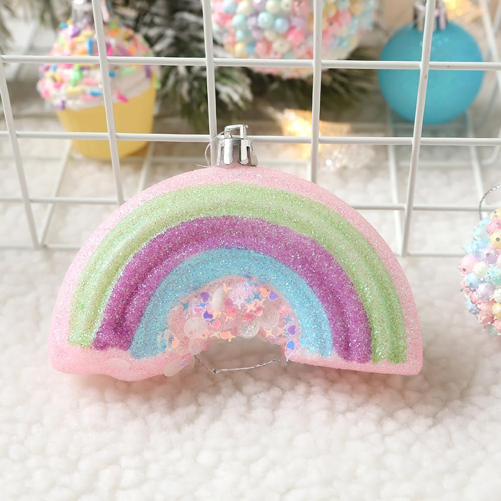 Pastel rainbow Christmas ornament with glitter and star confetti inside, close-up view.