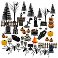Halloween village figurines including pumpkins, skeletons, tombstones, spiders, trees, and a cauldron on a white background.
