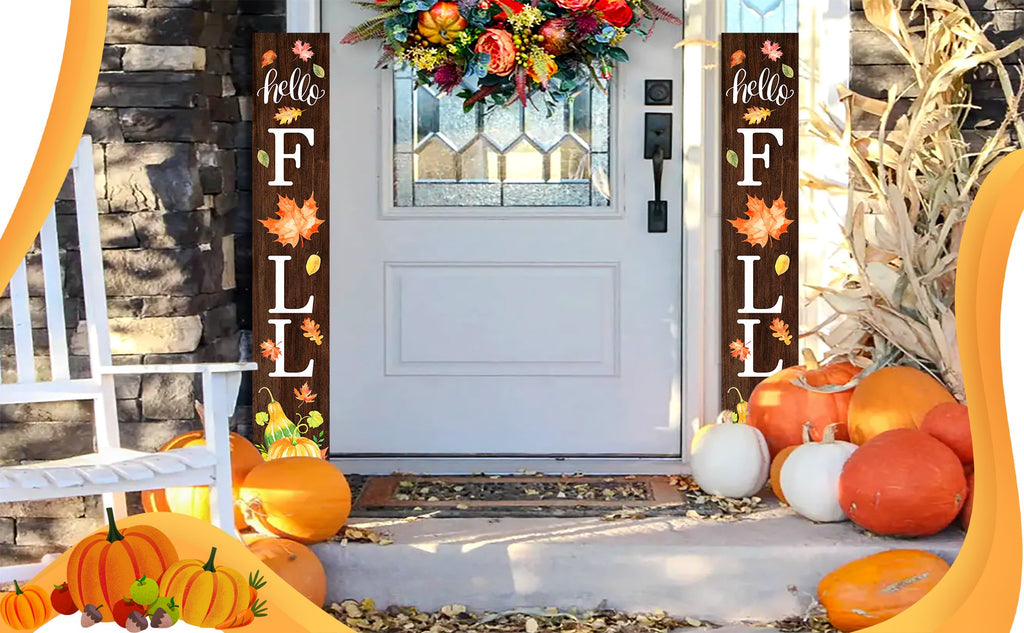 Wooden porch sign with 'hello FALL' text and autumn leaves, placed on a porch with pumpkins and a wreath on the door.