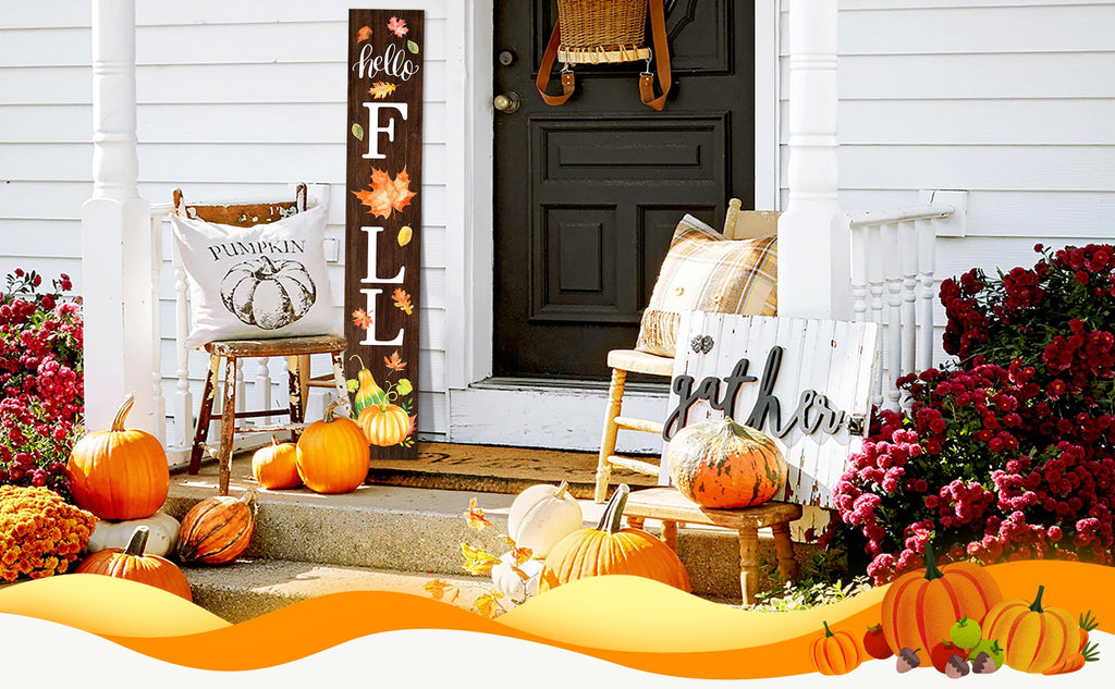 Wooden porch sign with 'hello FALL' text and autumn leaves, decorated with pumpkins and gourds on a porch.