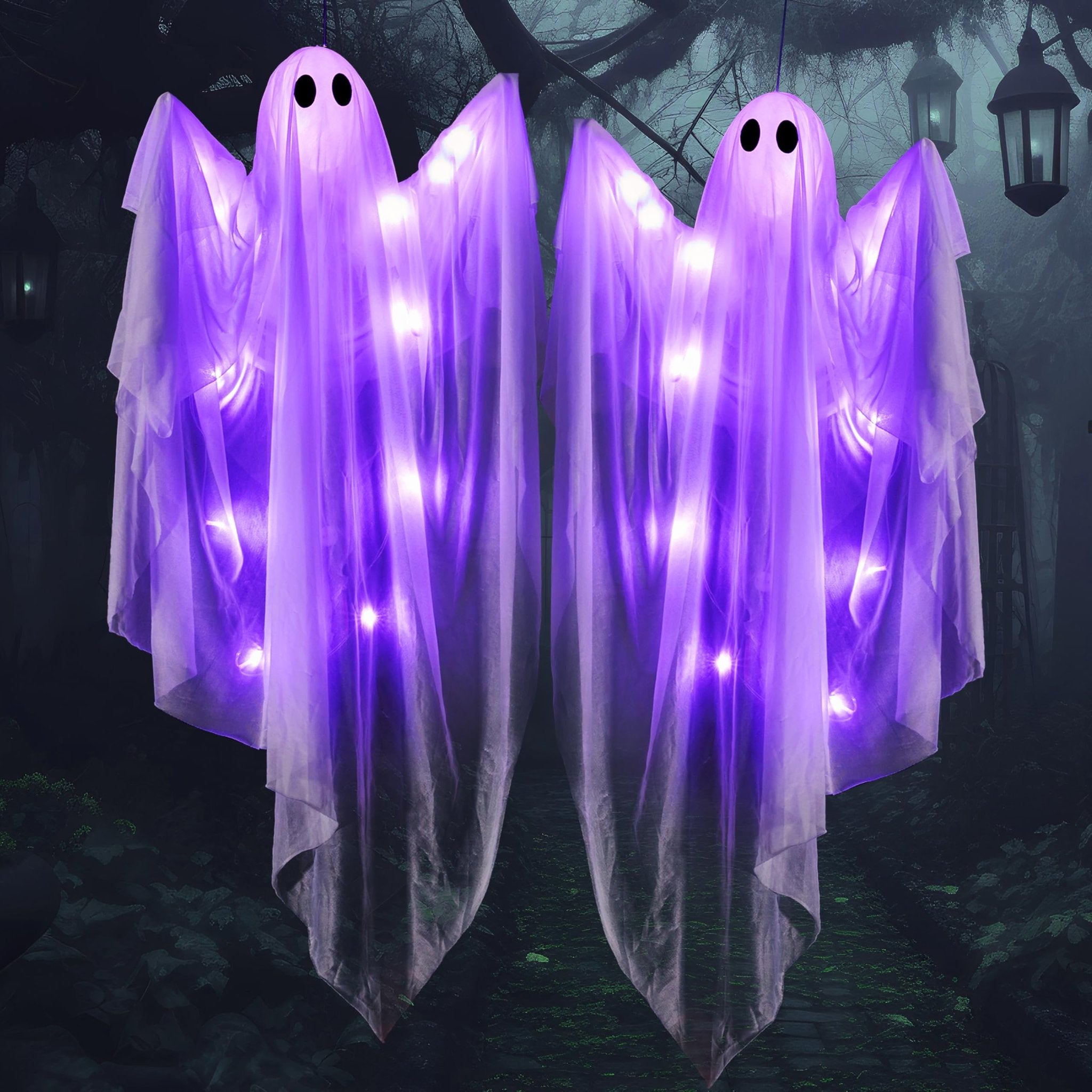 Two light-up hanging ghosts with purple LEDs against a dark, misty forest background with lanterns.