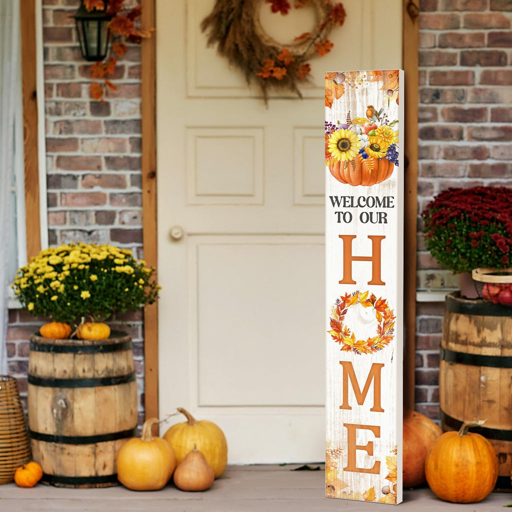 Vertical fall porch sign with pumpkin and sunflowers, reading 'WELCOME TO OUR HOME', decorated with autumn leaves.