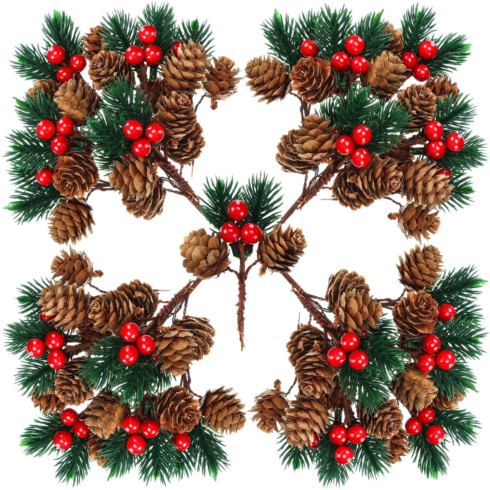Four artificial pine branch sprays with pine cones and red berries arranged in a symmetrical pattern on a white background.