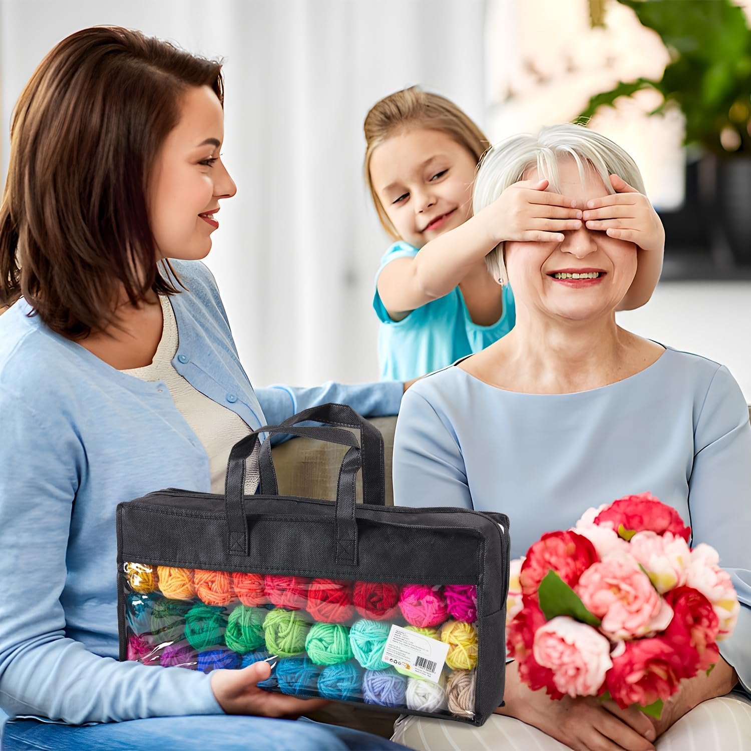 Woman holding a black storage bag filled with colorful yarn balls, with a child surprising a grandmother.