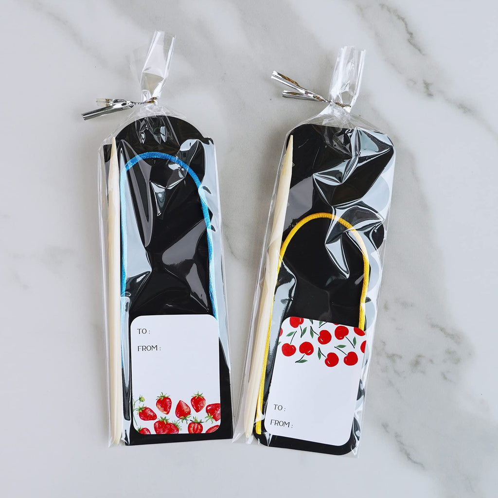 Two scratch art bookmark craft kits, each with a wooden stylus, cord, and gift tag, sealed in plastic packaging.