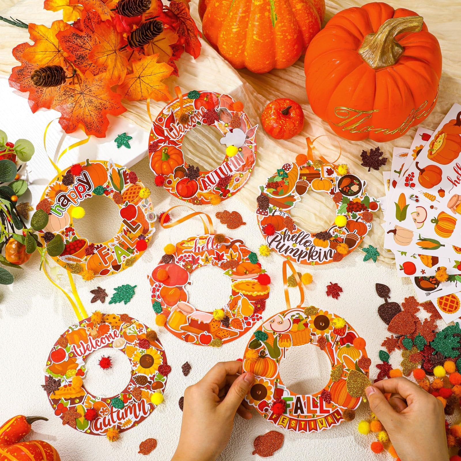 Autumn wreath craft kits with pumpkins, leaves, and fall themes, some with text like 'Happy Fall' and 'Welcome Autumn'.