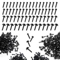 Black plastic craft eyes in various sizes scattered and arranged on a white background.