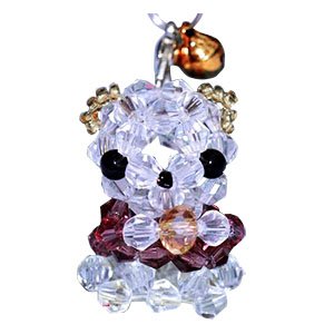 Beaded dog charm made from clear and colored faceted bicone crystal glass beads, with a small gold bell attached.