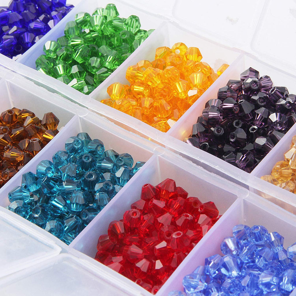 Assorted faceted bicone crystal glass beads in a clear organizer box, showing multiple colors like blue, green, yellow, purple, brown, teal, red, and light blue.