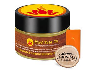 Wood burn gel in a jar with a wooden slice that says Merry Christmas and an orange applicator.