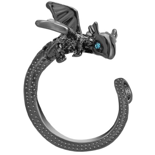 Black dragon ring with blue gem eyes, textured band, and wings, shown against a white background.