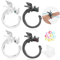 Two dragon-shaped crochet rings, one clear and one black, with stitch markers and a storage box.