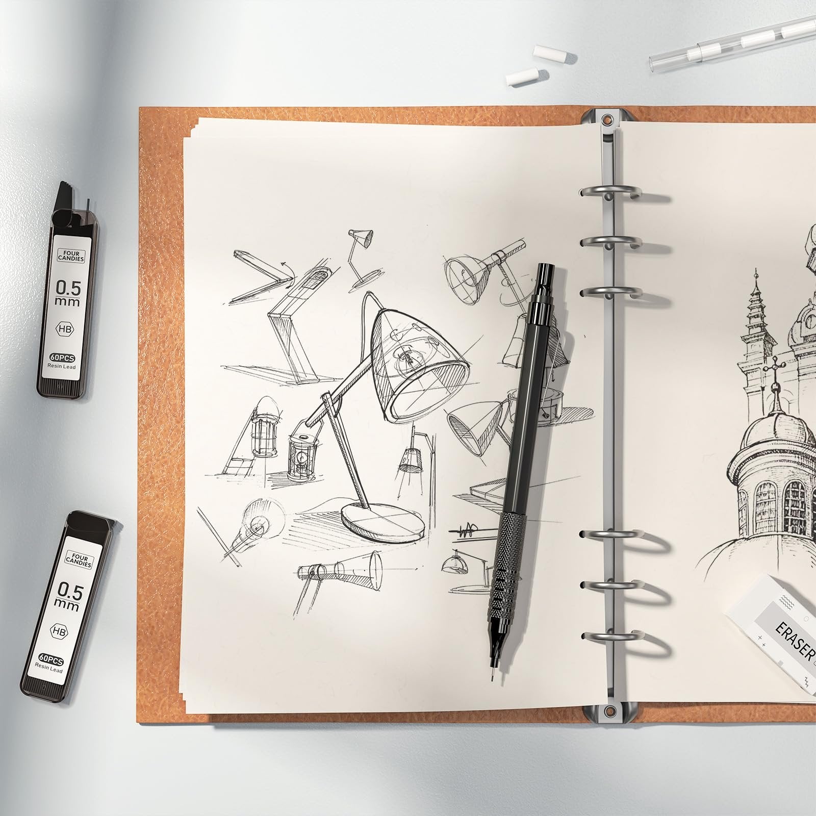 Mechanical pencil and lead refills on a sketchbook with lamp sketches and architectural drawings
