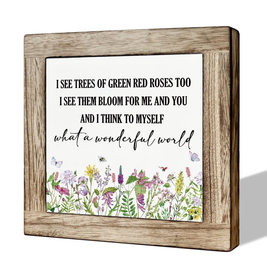 Wooden framed decorative sign with floral print and inspirational quote 'What a Wonderful World'.