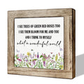 Wooden framed decorative sign with floral print and inspirational quote 'What a Wonderful World'.