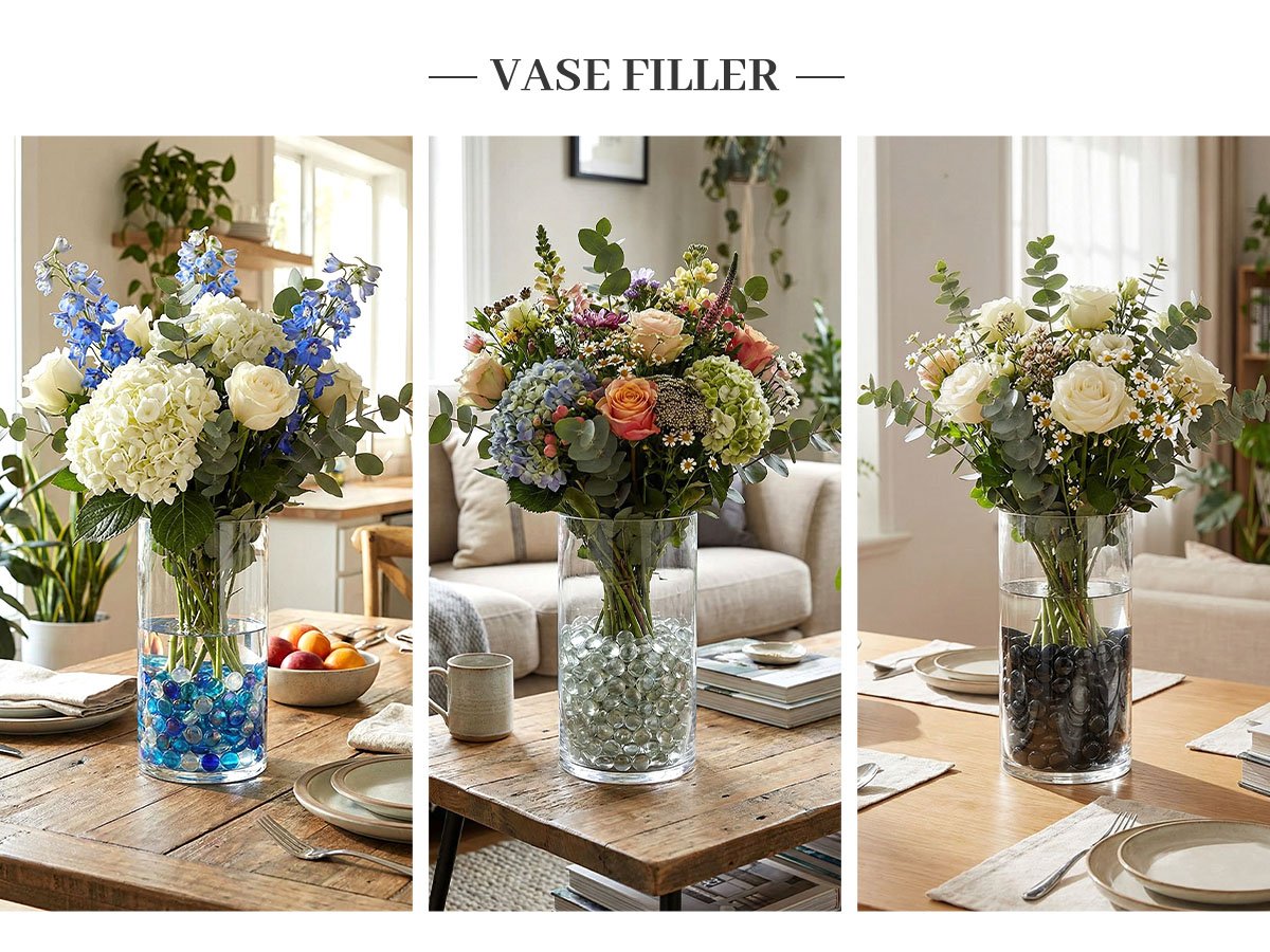 Three vases filled with colorful flowers and glass marbles on a wooden table.