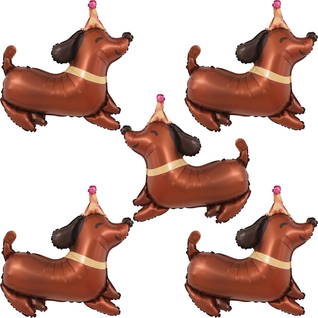 Five brown dachshund shaped foil balloons wearing party hats, arranged in a scattered pattern on a white background.
