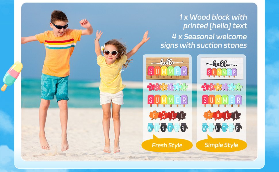 Two children jumping on a beach with a display of seasonal table signs