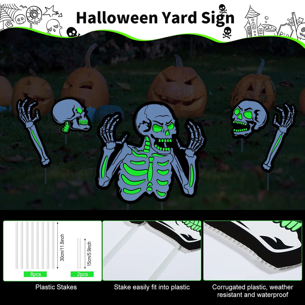 Halloween skeleton yard signs with carved pumpkins in the background, showing stakes and material details.