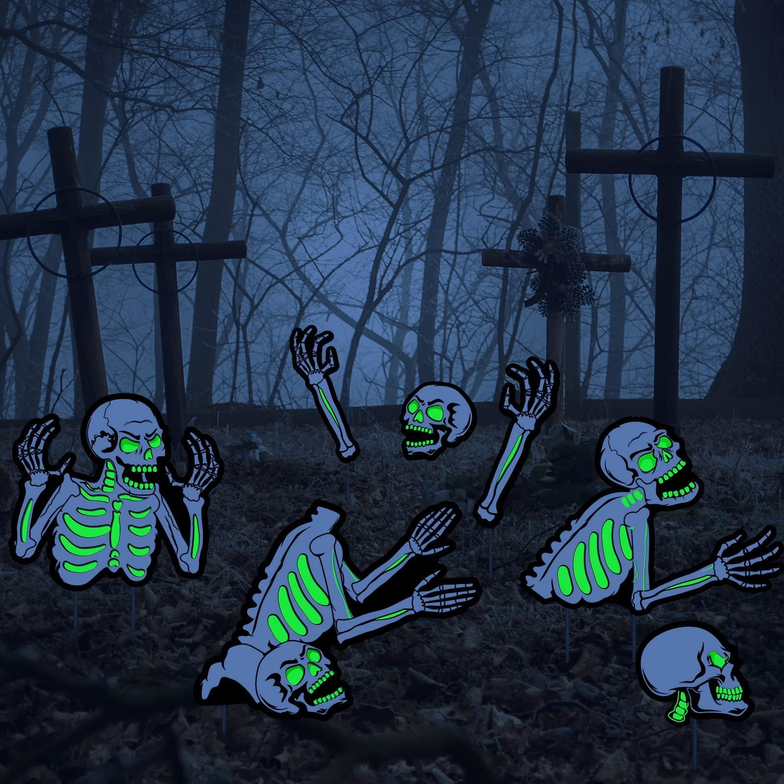 Five fluorescent skeleton yard signs with glowing green bones and skulls, arranged in a spooky graveyard setting with crosses and bare trees.