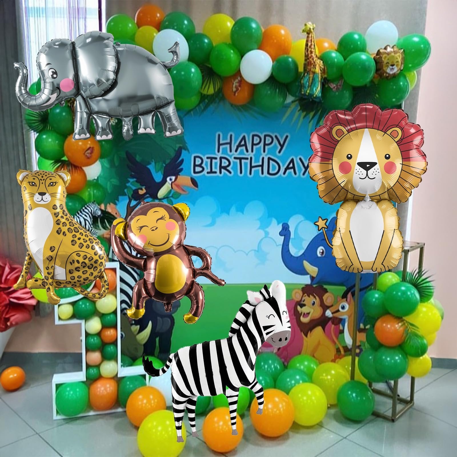 Safari animal balloons including elephant, lion, leopard, monkey, and zebra, with a 'Happy Birthday' backdrop.