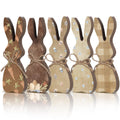 Five wooden Easter bunny table decor figures with twine bows, featuring carrot, egg, floral, and plaid patterns.