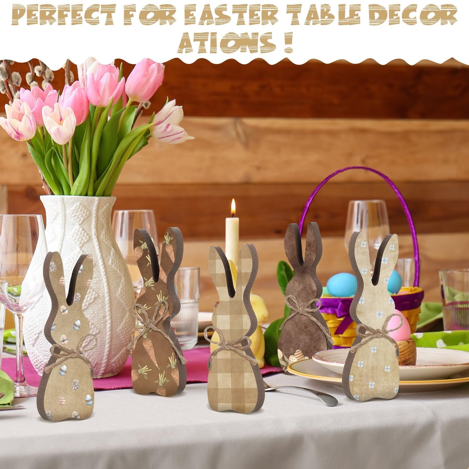 Five wooden Easter bunny table decor figures arranged on a table with tulips and Easter eggs.
