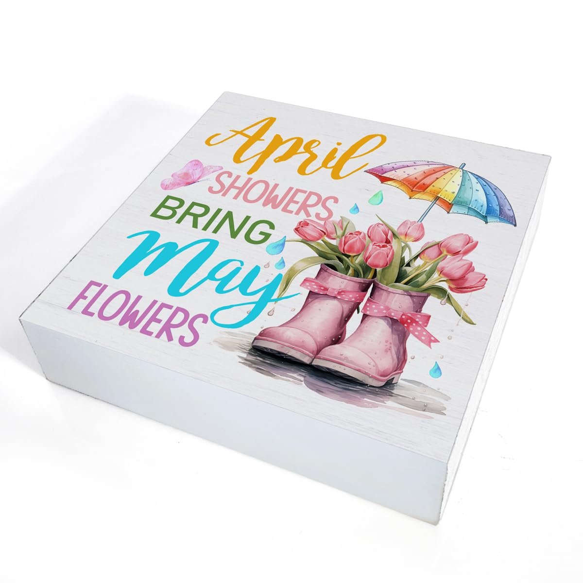 Wooden spring sign with pink boots, tulips, umbrella, and text 'April Showers Bring May Flowers'