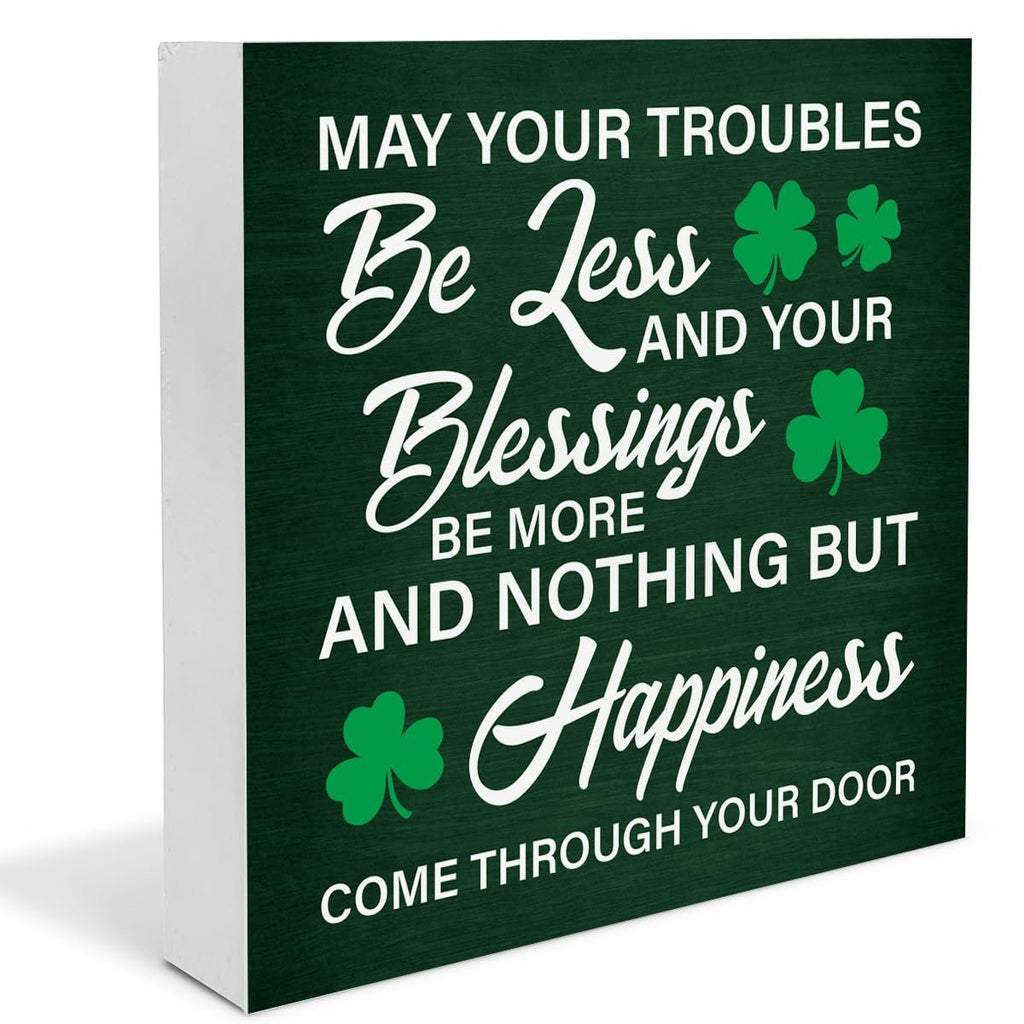 Wooden St. Patrick's Day sign with Irish blessing text and shamrocks, angled view.