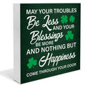 Wooden St. Patrick's Day sign with Irish blessing text and shamrocks, angled view.