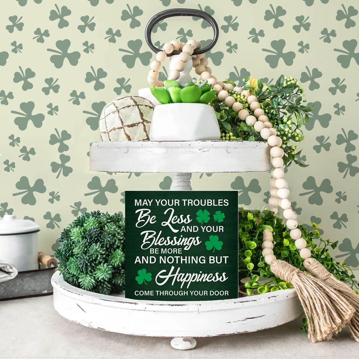 St. Patrick's Day wooden sign with Irish blessing on a tiered tray with greenery and decor