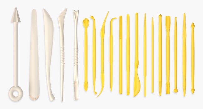 Collection of polymer clay sculpting tools in beige and yellow on a white background