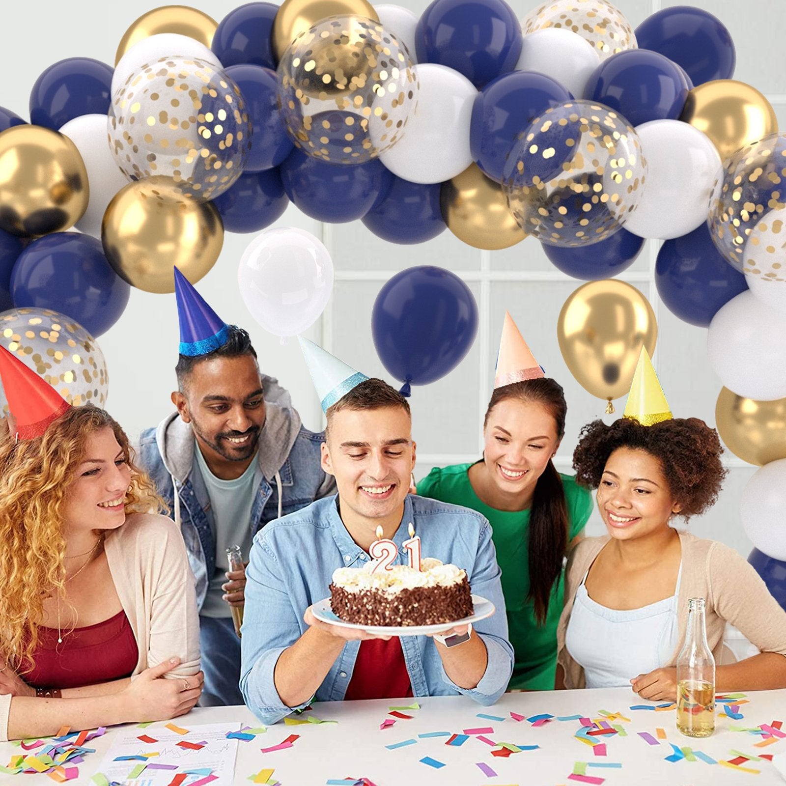 Group of friends celebrating a 21st birthday with a cake and balloons