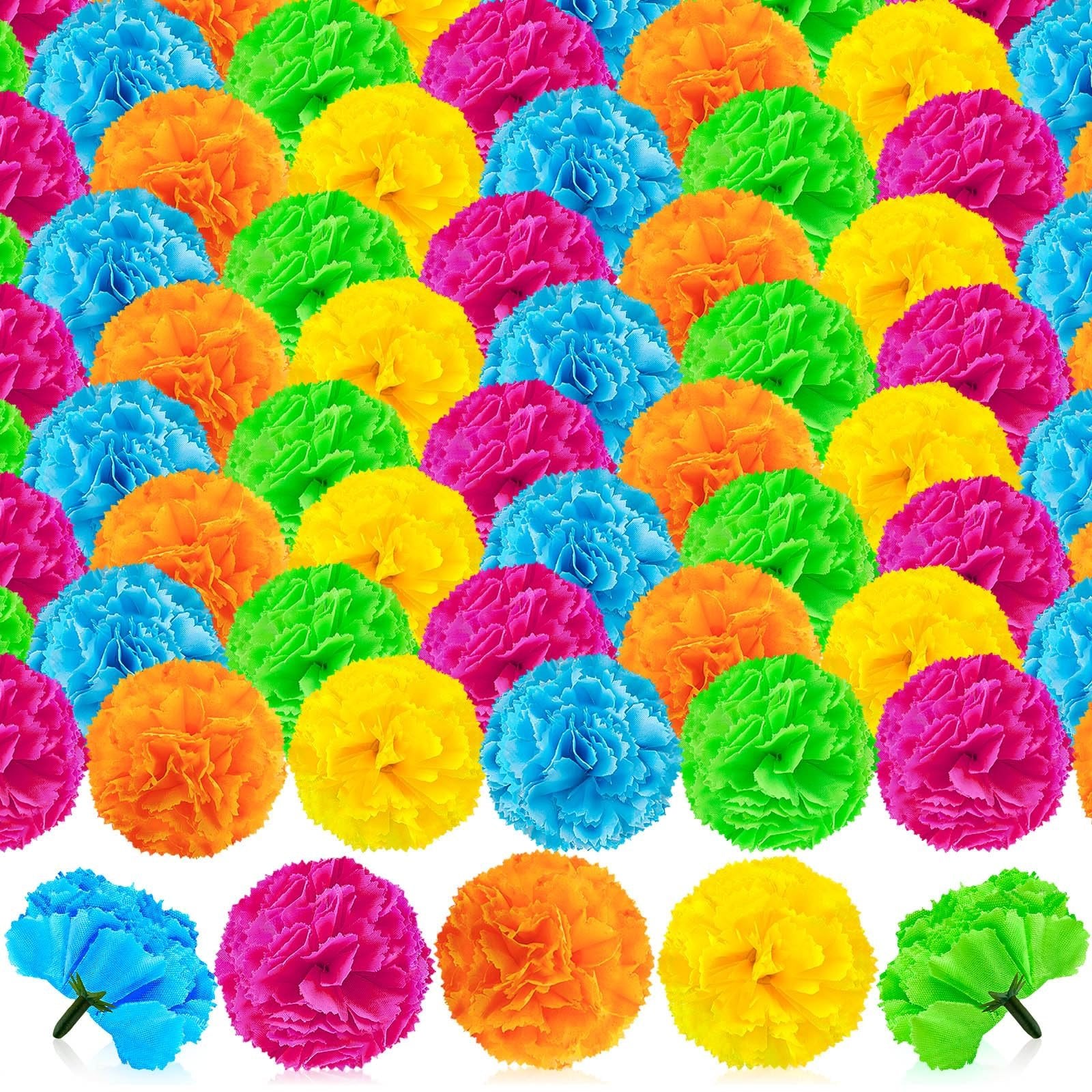 Assortment of colorful artificial marigold flower heads in blue, pink, orange, green, and yellow, some with stems.