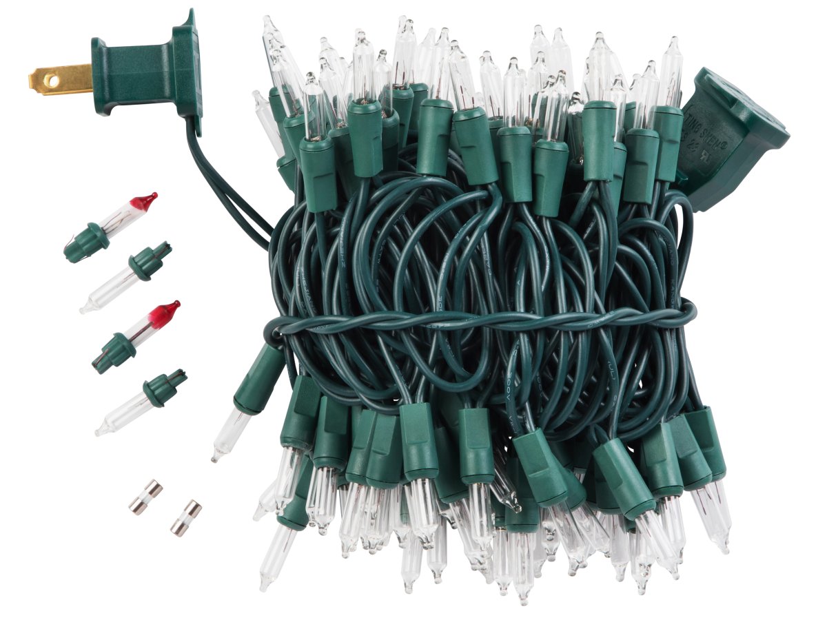 Bundle of 50 clear mini Christmas lights with green wire and plug, includes spare bulbs and fuses.