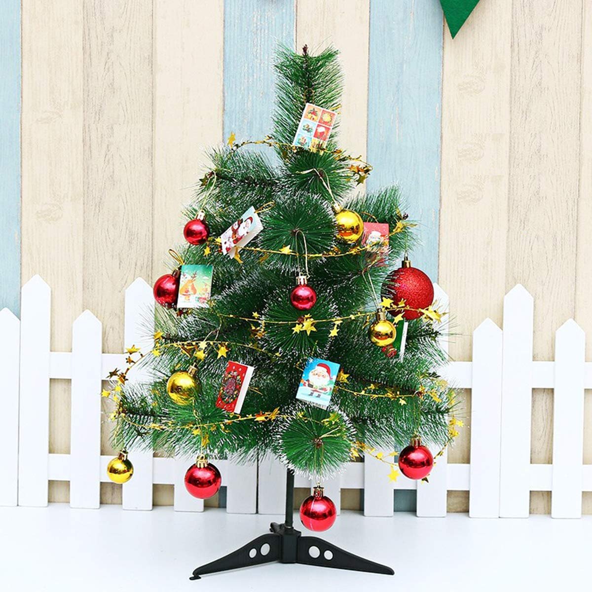 Decorated Christmas tree with red and gold ornaments and star tinsel garland