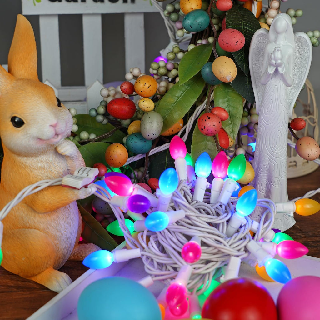 Easter-themed string lights with multicolor bulbs, a bunny figurine, and decorative eggs.