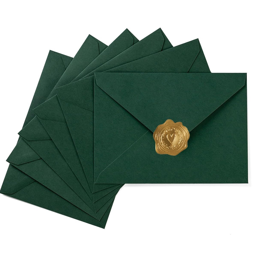 Stack of dark green A7 envelopes with gold heart-shaped wax seals on white background
