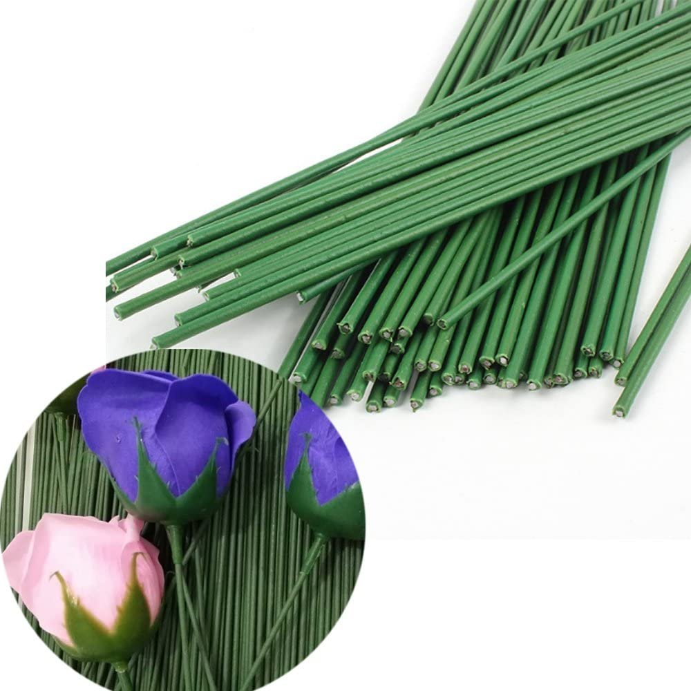 Bundle of dark green floral stem wires with artificial pink and purple roses in a circular inset.