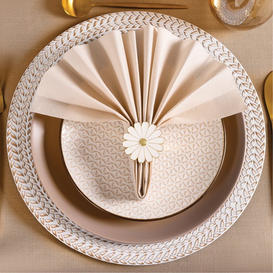 Table setting with folded beige linen-feel paper guest towels secured by a daisy napkin ring.