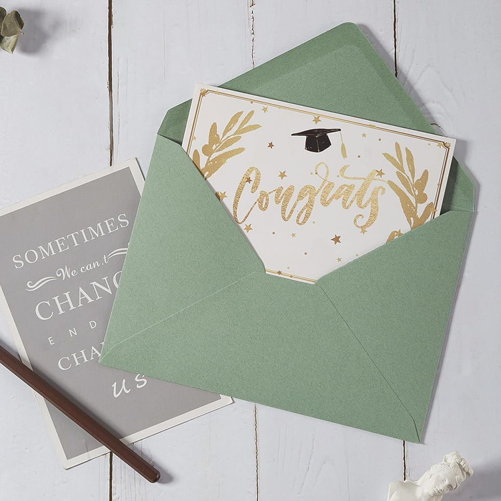 Sage green A7 envelope with a "Congrats" graduation card inside, next to a gray card with text.
