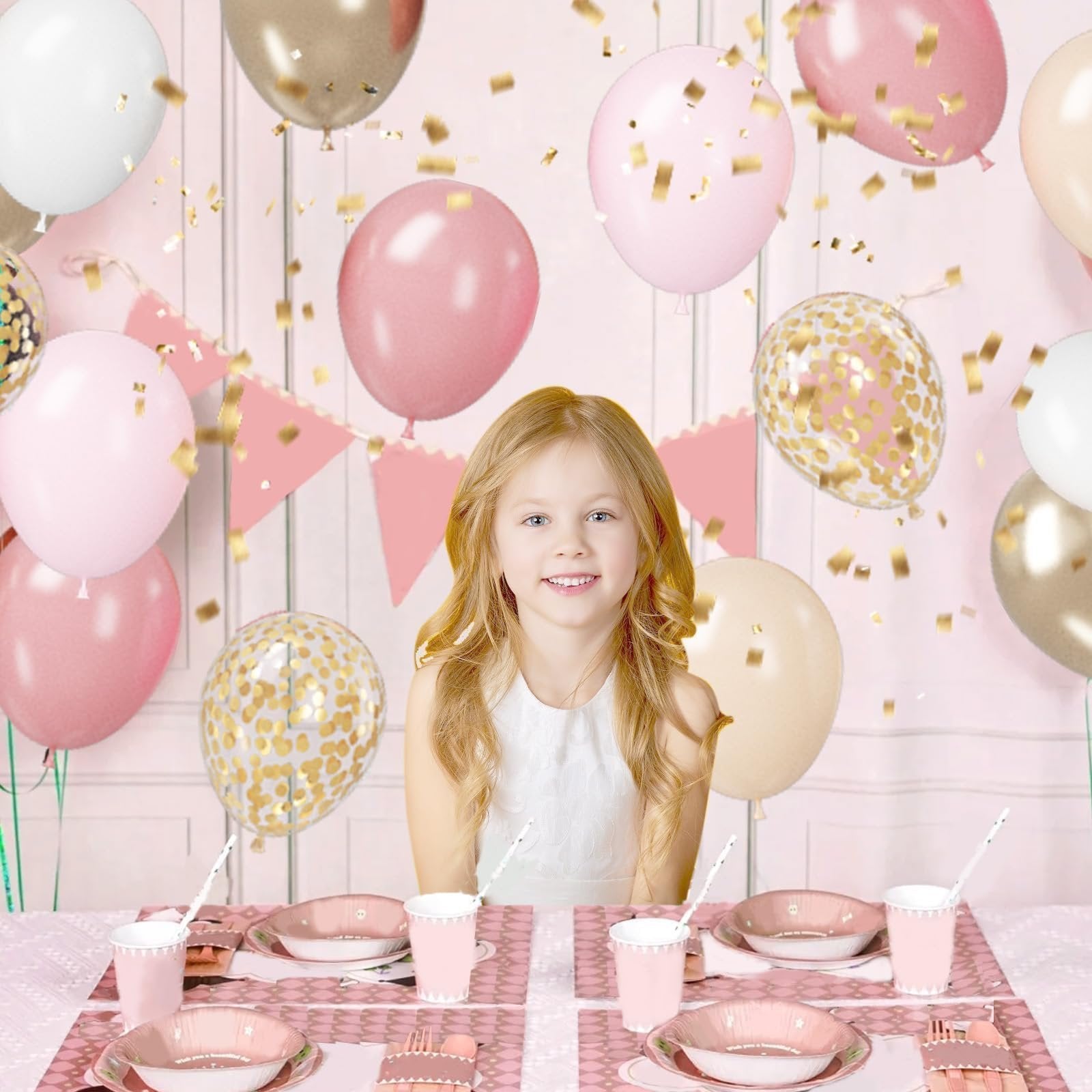 Young girl at a pink and gold party table setting with balloons and confetti