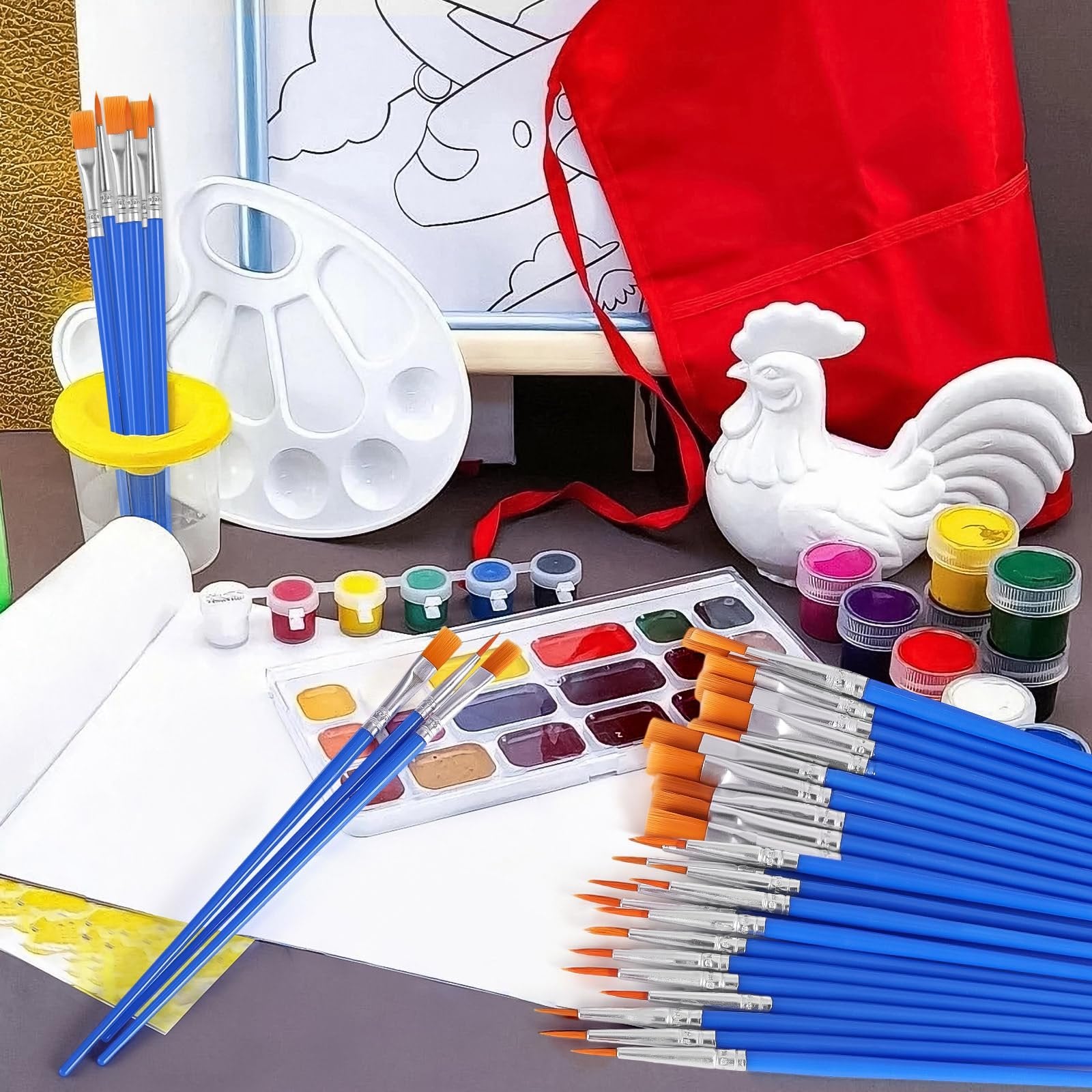 Art kit with paint brushes, watercolor palette, paint pots, and a ceramic rooster figure.