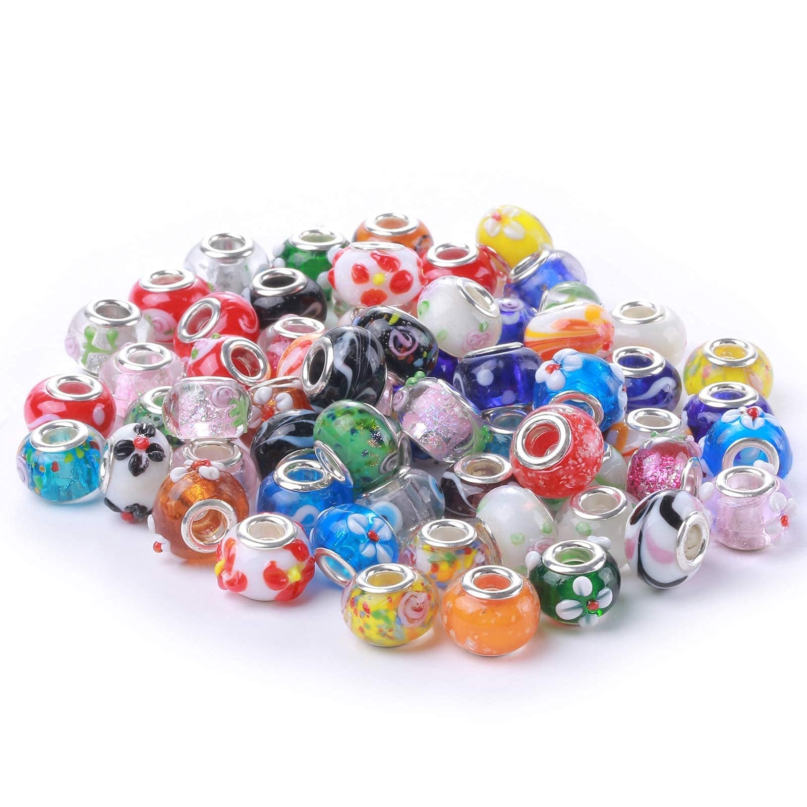 Pile of assorted colorful Murano glass beads with silver-plated cores for jewelry making, viewed from a slightly elevated angle.