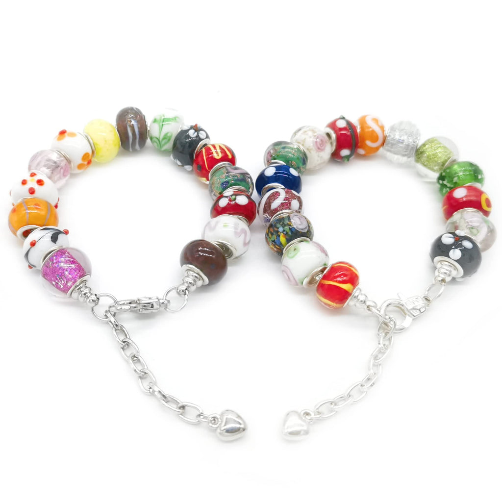 Two bracelets made of mixed Murano glass beads with silver-plated cores and chain links, displayed on a white background.