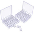 Two clear plastic storage cases filled with transparent sewing machine bobbins, with a few bobbins outside the cases.
