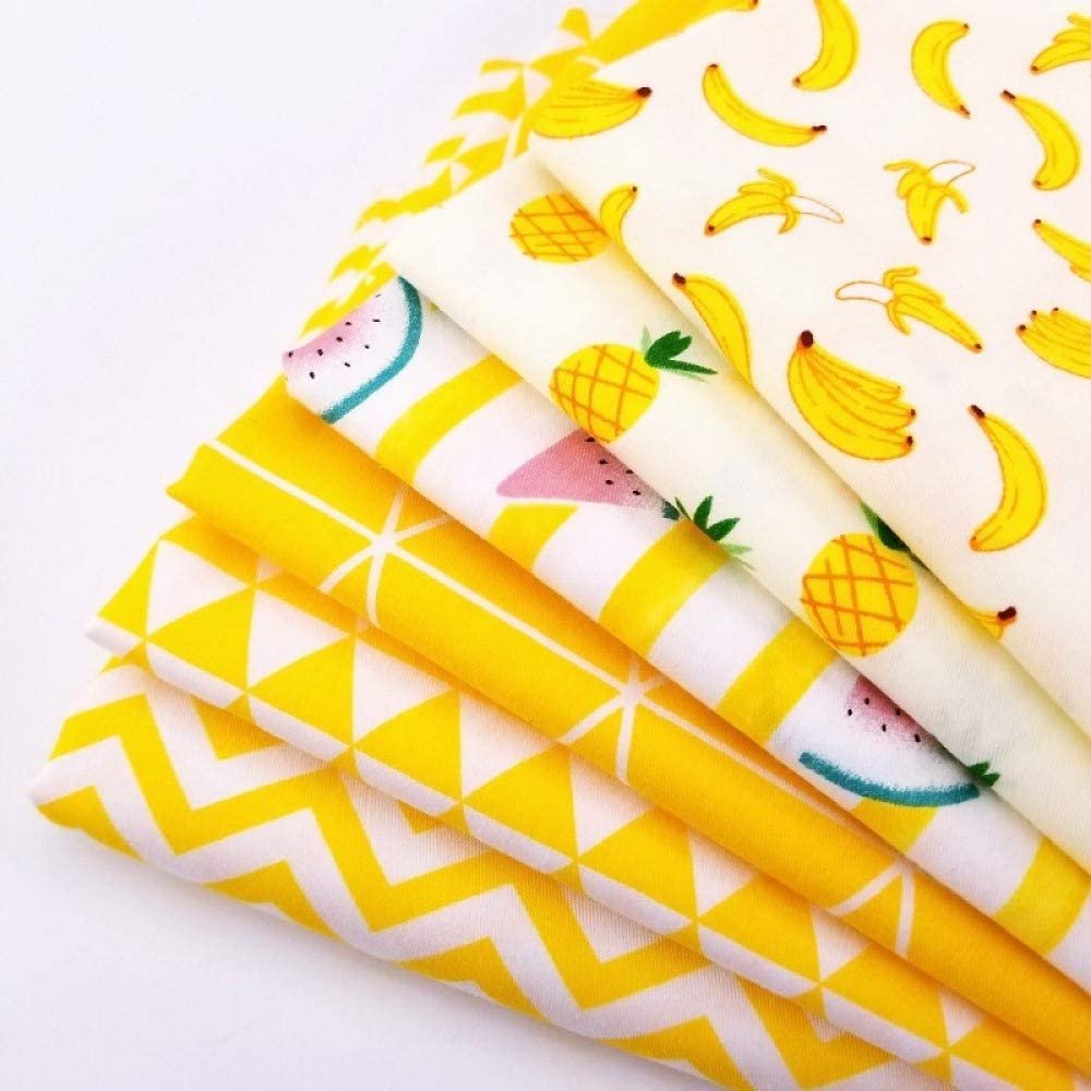 Stack of five yellow and white patterned fabric squares featuring bananas, pineapples, and watermelon slices.