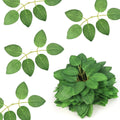 Artificial green rose leaves with plastic stems on a white background, showing several individual stems and a cluster of leaves.